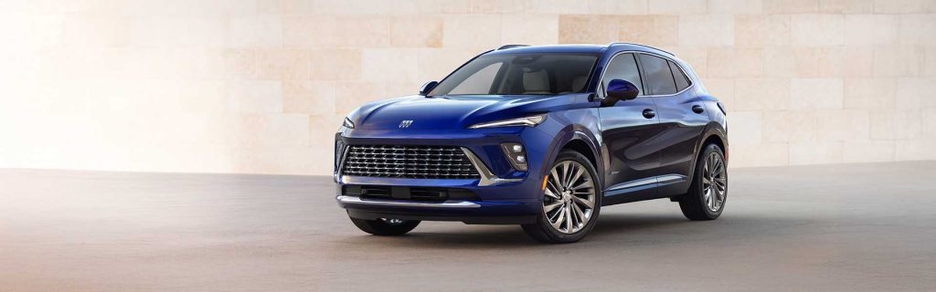 A blue Buick SUV parked in front of a light-colored wall.