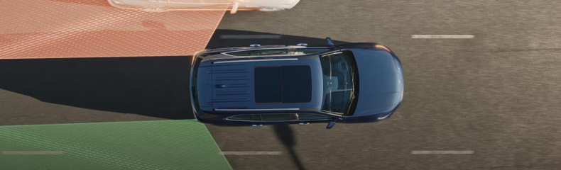 Overhead view of a blue Buick Enclave with colored sensor zones showing its driver-assistance coverage
