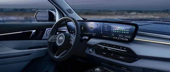 Interior of the 2026 Buick Enclave showing the steering wheel and the 30-inch ultrawide dashboard display