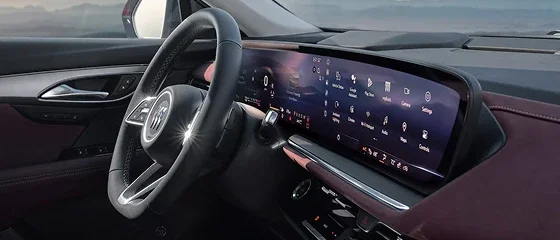 Interior of the 2026 Buick Envision showing the steering wheel and the ultrawide dashboard display