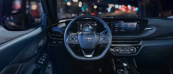 Interior of the 2026 Buick Envista Preferred at night showing the steering wheel, driver display and 11-inch touchscreen